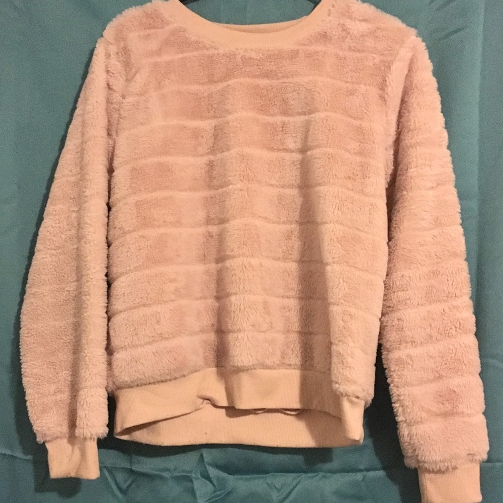 A Soft and Fluffy Oversized Blush Sweater